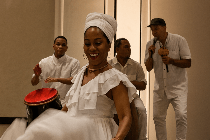 Woman dances in white dress while musicians play drums and sing on stage.